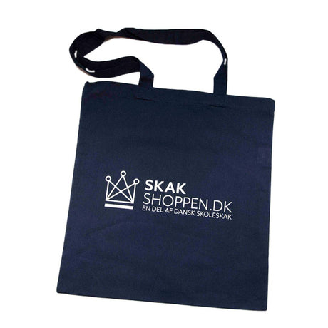 Siden af en blå mulepose i stop med skekshoppen.com en del af dansk skoleskak trykt på siden